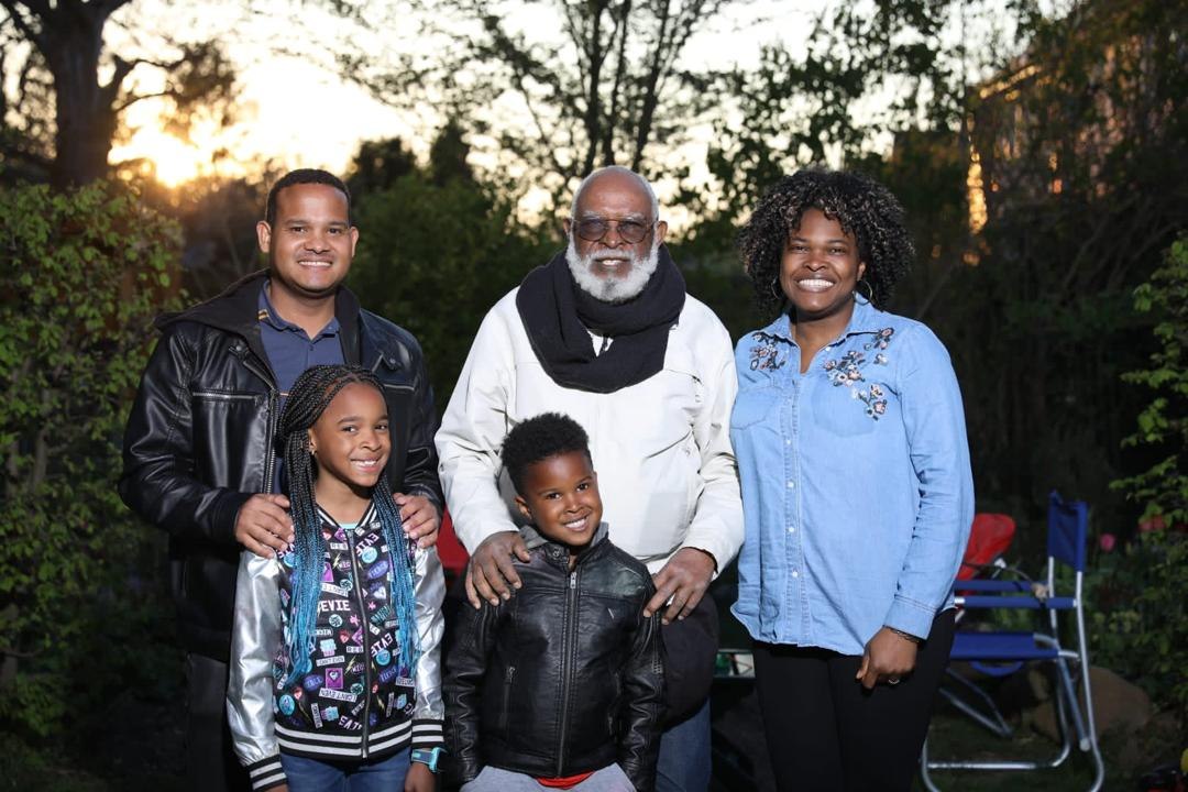 Grandpa Ole outdoors with family and grandchildren